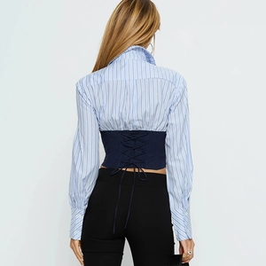 Detailed back view of a striped long-sleeve shirt featuring a navy lace-up waist corset