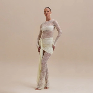 Close-up of elegant lace texture and waist drape detail on long sleeve jumpsuit