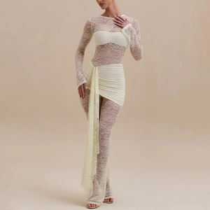 Detail of elegant cream lace jumpsuit with long sleeves and hollow-out floral lace texture