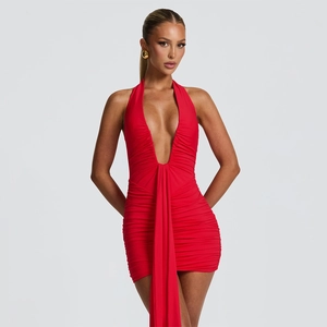 Detail of red ruched bodycon dress featuring a deep V-neck and long waist streamer
