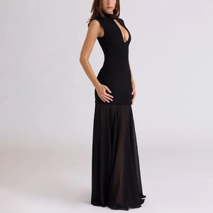 Detail of slim fit black sleeveless dress featuring chic teardrop cutout at the chest