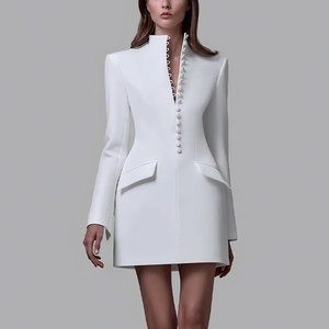 Close-up of structured white blazer dress with single-breasted buttons and side pockets