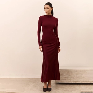 Macro view of burgundy high neck long sleeve dress with slim fit tailoring and knit texture