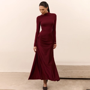 Elegant burgundy high-neck long-sleeve maxi dress with a slim-fit waist and draped skirt