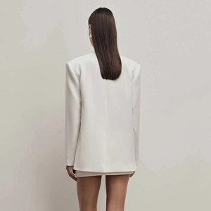 Minimalist white tailored blazer with shoulder pads, back view of modern silhouette