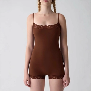 Close-up of the delicate lace trim on the neckline of this brown sleeveless bodysuit