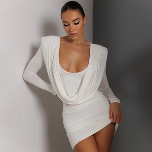 Detailed view of white long sleeve dress with cowl neck and textured ruched fabric