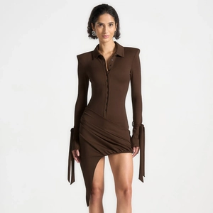 Detail view of dark brown polo dress with shoulder pads and sleeve ties