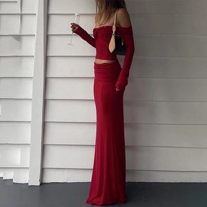 Elegant red two-piece set with off-shoulder long sleeve top and slim-fit maxi skirt