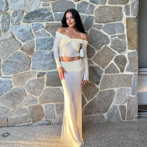 Elegant off-shoulder long sleeve top and matching high waist maxi skirt set in beige color