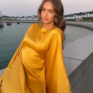 Elegant gold satin dress with batwing sleeves and round neck for summer social events