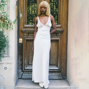 Elegant white V-neck maxi dress with heart patches and open back for summer