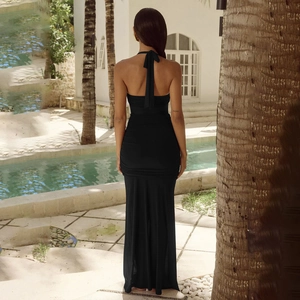 Elegant black halter backless maxi dress with side slit and gathered ruched detailing