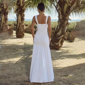 White backless maxi dress with side slit and elegant ruching for beach vacations