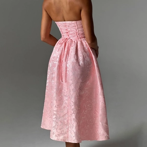 Elegant pink strapless backless evening dress with floral jacquard texture and tie-back detail