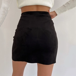 Sexy black faux suede mini skirt with high waist slim fit design shown from the back