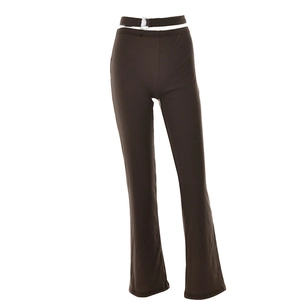Detailed view of dark brown high-waist flared pants with decorative silver ring at the waist