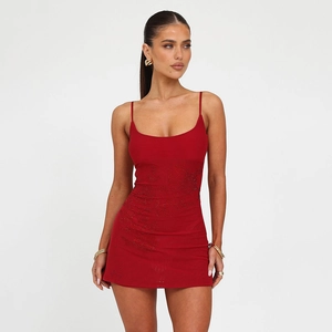 Detailed view of red bodycon mini dress featuring intricate sequin leaf embroidery