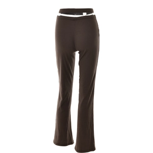 Detail of dark brown ribbed knit flare pants featuring a sexy hollow-out double waistband design