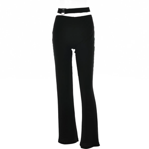 Detail of black low-rise flared pants with side hollow-out and silver metal ring buckle