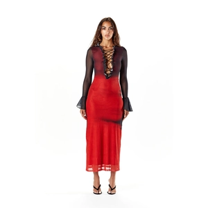 Detailed view of sheer mesh fabric with red and black gradient dye and ruffled edges