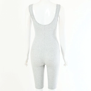 Detail view of grey ribbed knit romper showing the sexy deep U-back design and texture