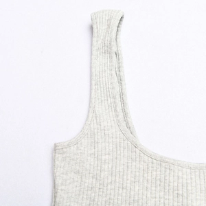 Close-up detail of grey ribbed knit cotton fabric texture and stitching on the bodysuit