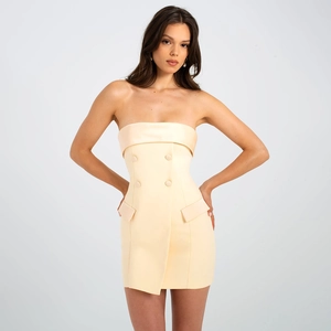 Detail of light yellow strapless blazer mini dress with double-breasted buttons and flaps