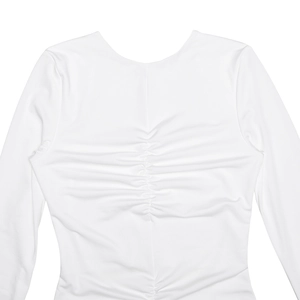 Close-up of ruched back detail on white long sleeve dress with seamless stitching