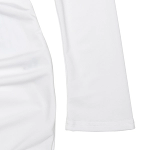 Detail of white long sleeve dress showing fine stitching and elegant ruched fabric texture