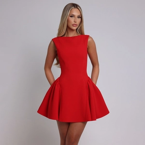 Macro view of the sleeveless red mini dress featuring ruched details and side pockets