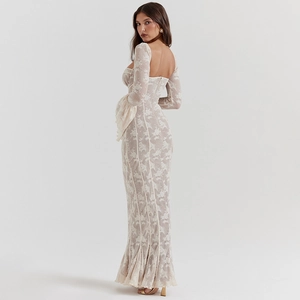 Detail of elegant white lace fabric with floral embroidery on a slim-fit evening dress