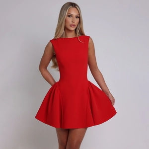 Detail of red sleeveless mini dress featuring side ruching and a slim silhouette