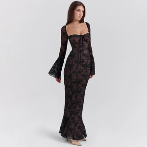Detail of elegant black lace dress featuring flared sleeves and a chic mermaid hemline