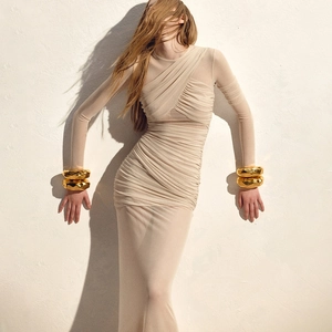 Slim fit long sleeve sheer mesh dress in apricot with ruched texture and golden cuffs