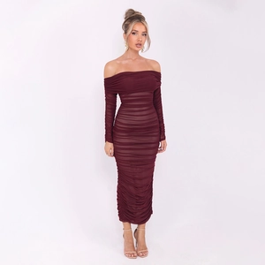 Close-up of ruched texture on elegant off-shoulder long-sleeve burgundy bodycon dress