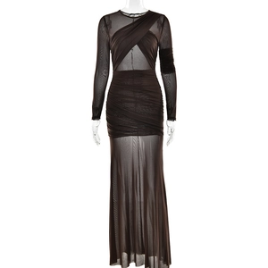 Close-up of sheer dark brown mesh fabric and crossed ruched design on long sleeve dress