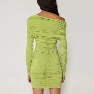 Back view of avocado green ruched mini dress showing slim fit and off-shoulder design