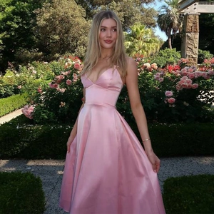 Elegant pink satin maxi dress with deep V-neck and open back for evening party