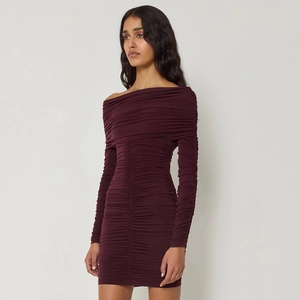 Detailed close-up of ruched burgundy off-the-shoulder bodycon mini dress with long sleeves