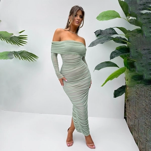 Detail of light green ruched maxi dress with off-the-shoulder design and elegant fit