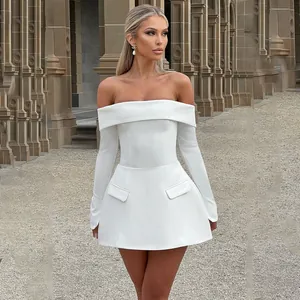Detail of off-the-shoulder white mini dress featuring long sleeves and decorative pockets