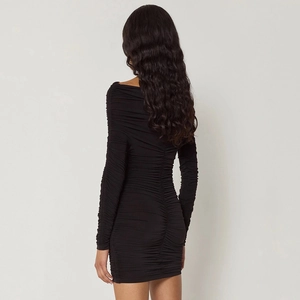 Detail shot of the ruched texture and fitted back design of this black long sleeve dress