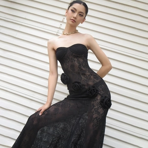 Detail of elegant black lace strapless dress featuring 3D rose floral appliqués