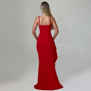 Detail of red backless maxi dress with thin straps and ruffled fishtail hem detail
