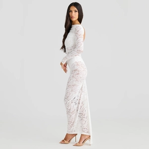 Close-up of white lace long-sleeved dress with intricate floral patterns and slim silhouette