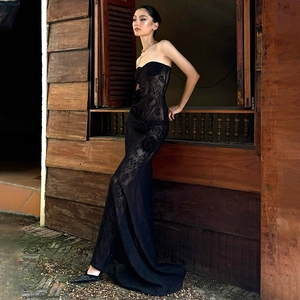 Close-up of black lace strapless fishtail dress with 3D rose flower floral detailing