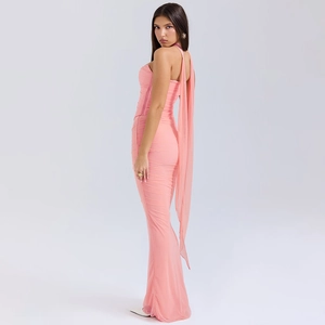 Detail of pink ruched maxi dress with halter neck and long elegant back streamers
