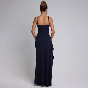 Detail of elegant backless navy blue evening dress with ruffled slit and slim fit design