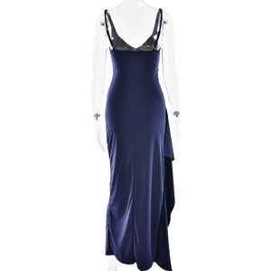 Detail of navy blue backless maxi dress featuring thin straps and side high slit